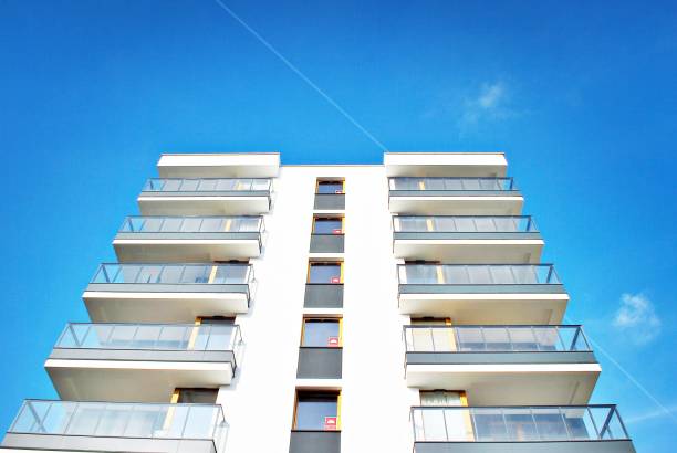 istock Modern apartment buildings on a sunny day with a blue sky. 879393658