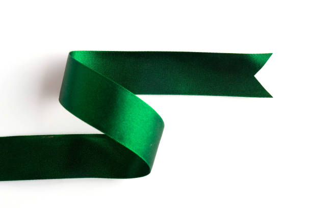 istock Green bow ribbon satin texture isolated on white background 879393704