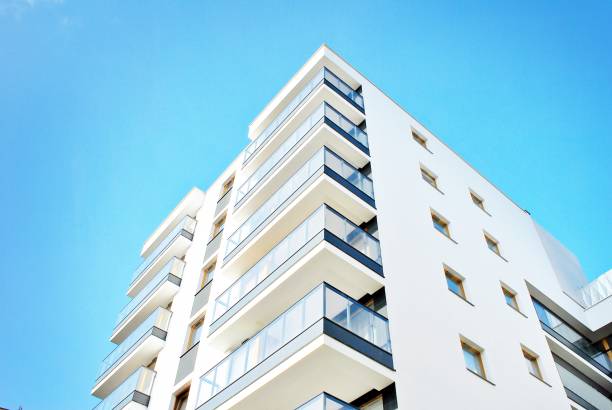 istock Modern apartment buildings on a sunny day with a blue sky. 879393930