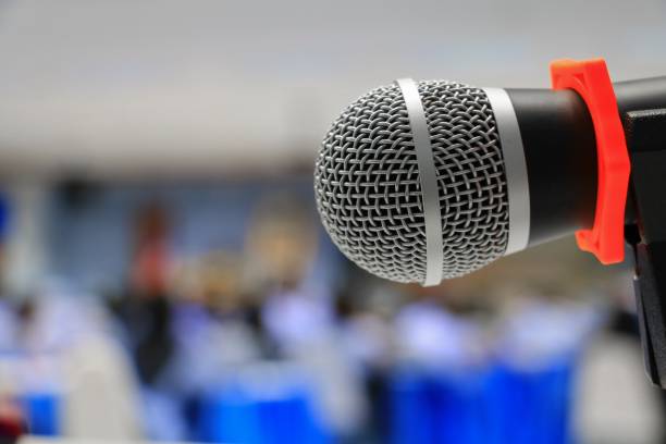 istock microphone on stand Close up in conference room :Select focus with shallow depth of field. 879427938