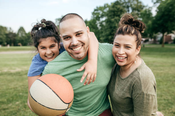 Picnic with family Family of three playing basketball 30 39 years photos stock pictures, royalty-free photos & images