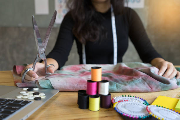 istock young fashion designer work with fabric cloth 879438496