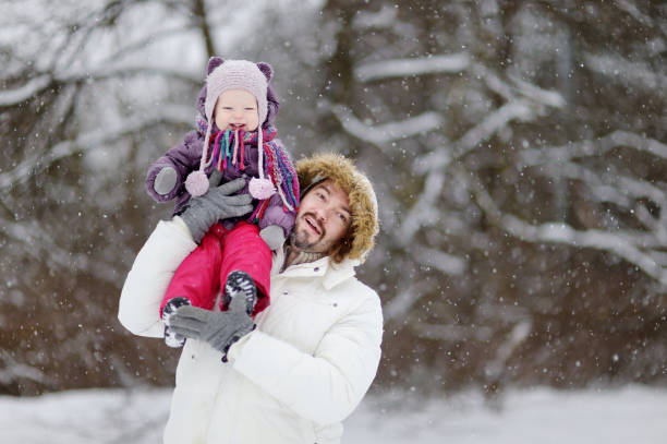 istock Young father and his daughter at winter day 879438542