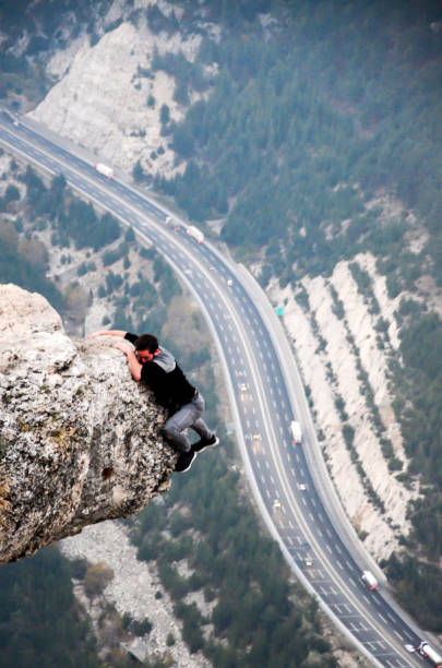 istock Mountain Man Success Concept on high Rock 879438900