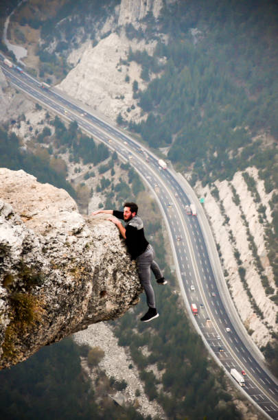 istock Mountain Man Success Concept on high Rock 879438904