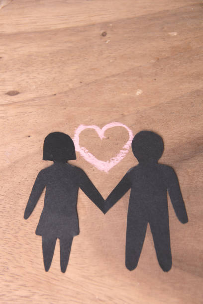 istock Two human figure holed hand with love 879441526