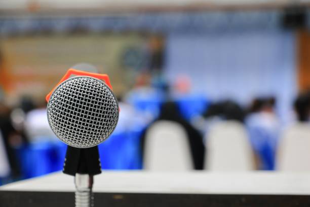 istock microphone on stand Close up in conference room :Select focus with shallow depth of field. 879442064