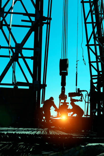 istock drilling exploration, the oil workers are working 879460048