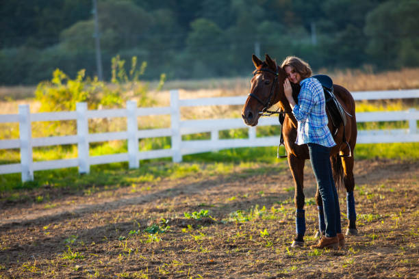 istock Beautiful girl with horse 879471444
