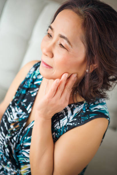 istock Smiling asian senior portait 879474204