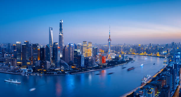 istock Shanghai skyline at sunset, blue toned. 879481950