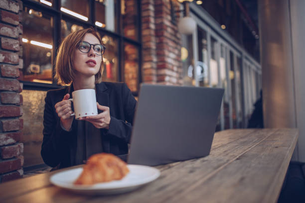 istock Young woman working in the cafe 879484640