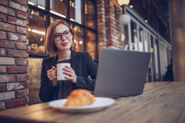 istock Woman working in the cafe 879489170