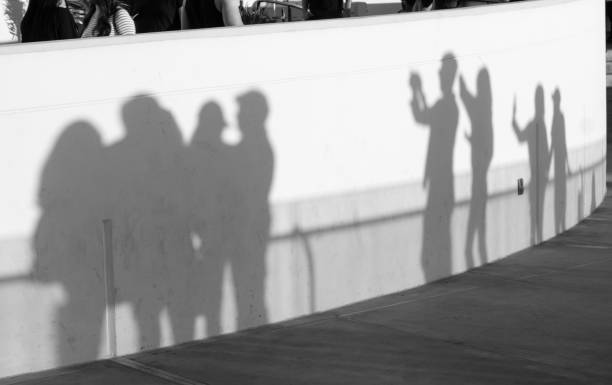 istock Tourist Shadows Snapping Photos at Los Angeles Landmark 879500092