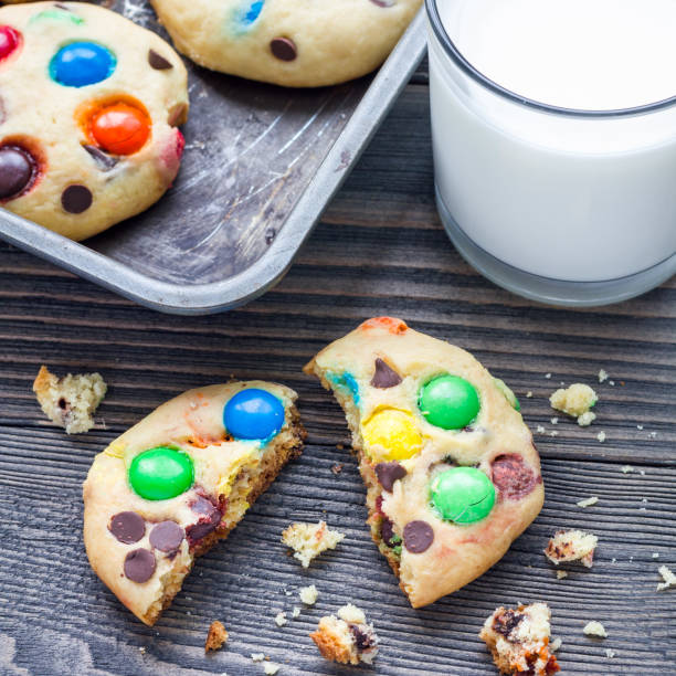 istock Shortbread cookies with multi colored candy and chocolate chips on metal tray, square 879515422