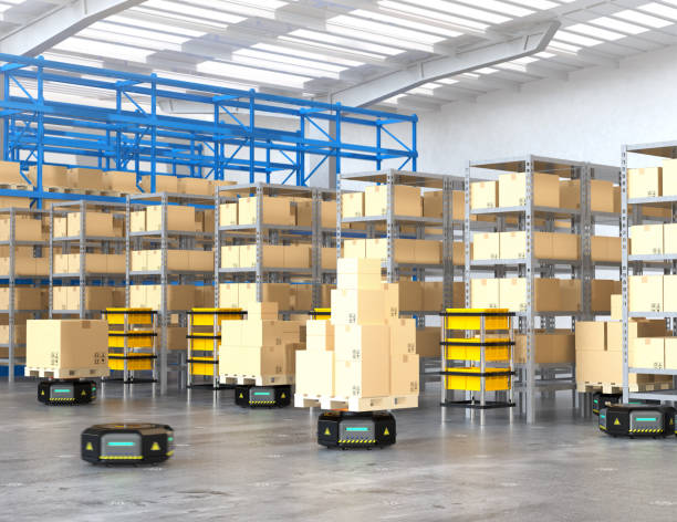 istock Black robot carriers carrying goods in modern warehouse 879518414
