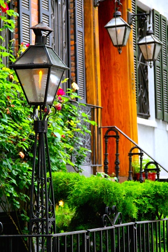 Lanterns on a quaint city street in New York City's lower east side during the summer.