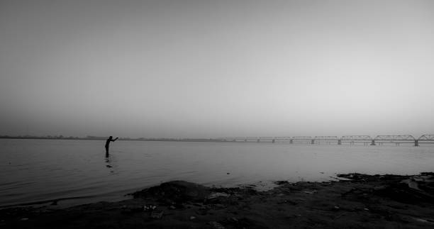 Pilgrim across River Sarayu, Ayodhya stock photo