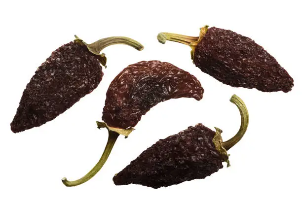 Smoke-dried overripe Jalapeno chile peppers or Chipotles. Top view, clipping path