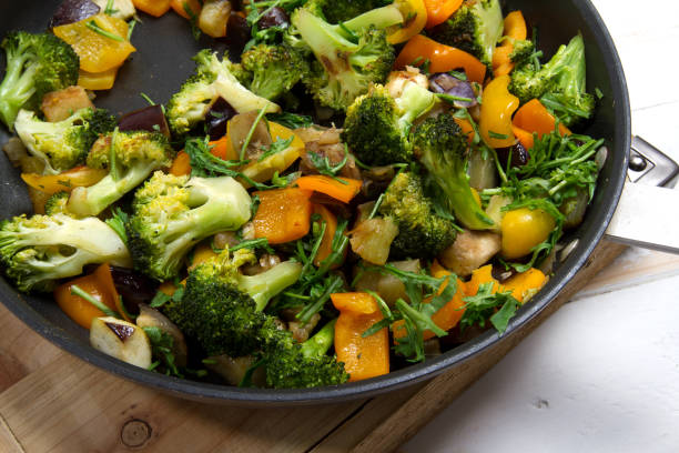 istock Stewed vegetables: broccoli, garlic, onions, bell peppers, eggplant and arugula 879540874