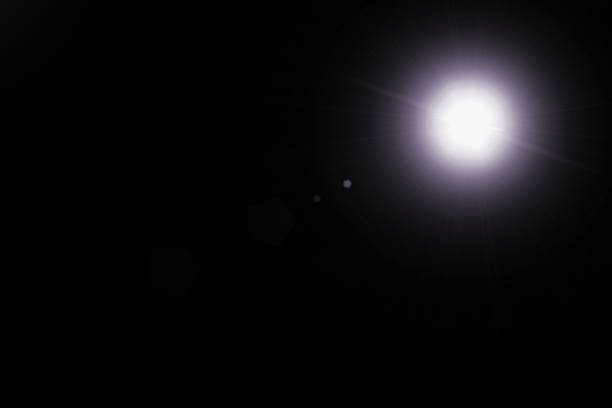 istock digital lens flare,sun burst on black background 879557128