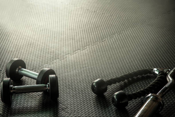 istock Fitness concept with gym equipment. 879557434