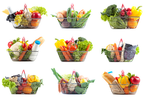 Shopping Concept:  Nine Different Perfect Shopping Carts Filled with  Bottle of Milk and Red Wine, Bread, Vegetabless and Fruit on White Background