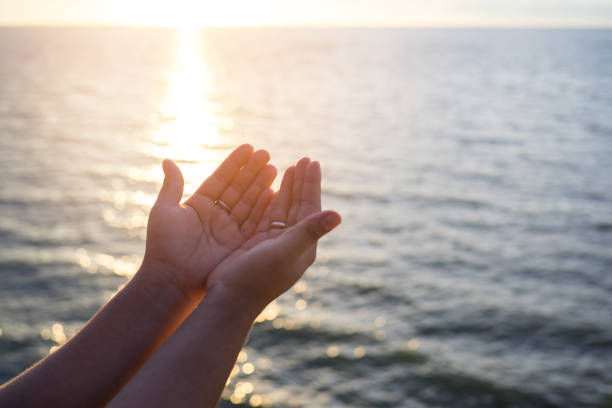 istock Human hands open palm up worship. Eucharist Therapy Bless God Helping Repent Catholic Easter Lent Mind Pray. Christian Religion concept background. fighting and victory for god 879573468