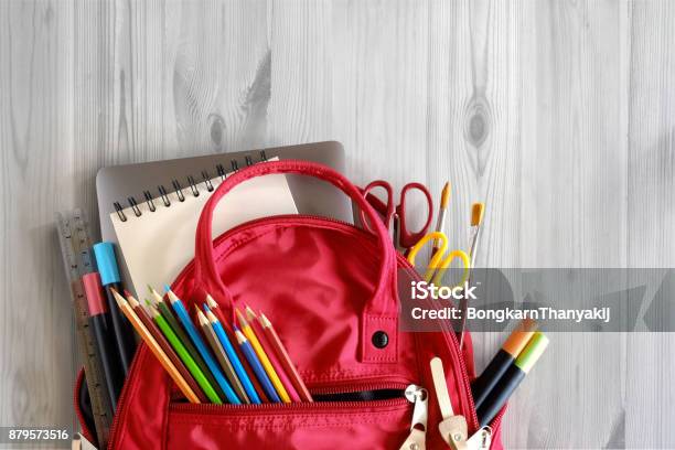 School Backpack And School Supplies On White Wood Table Background Back To School Concept Stock Photo - Download Image Now