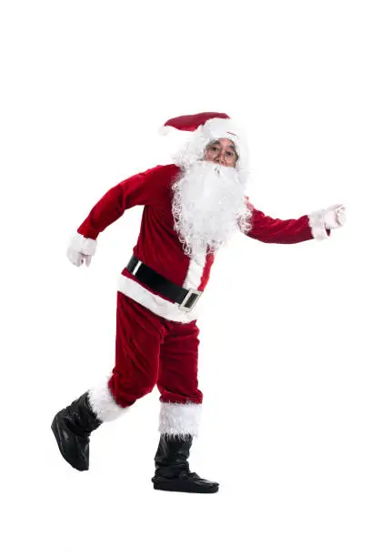 Happy traditional Santa Claus running isolated on white background.