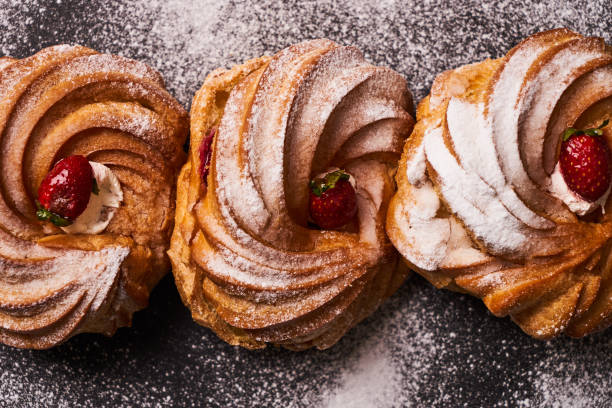 istock Profiterole, french puff pastry eclairs 879579456