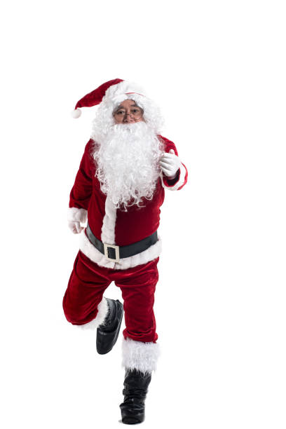 istock Happy traditional Santa Claus running isolated on white background. 879579458