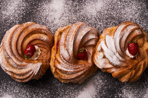 istock Profiterole, french puff pastry eclairs 879579570