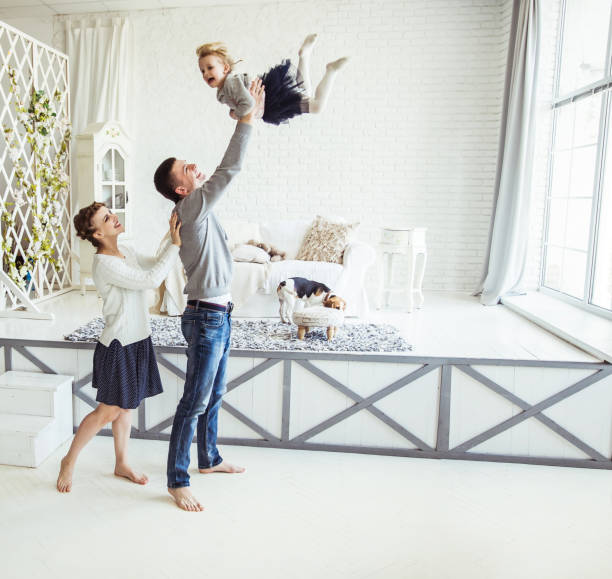 istock loving parents play with their young daughter 879581914