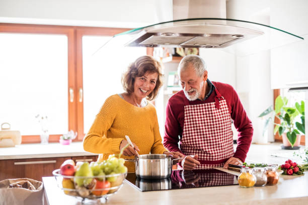 istock Senior couple preparing food in the kitchen. 879588806