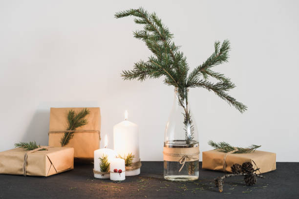 istock Christmas decorations with lit candles and gift boxes 879595110