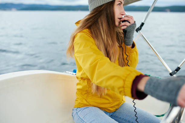 istock Yachtswoman sailing the boat 879595256
