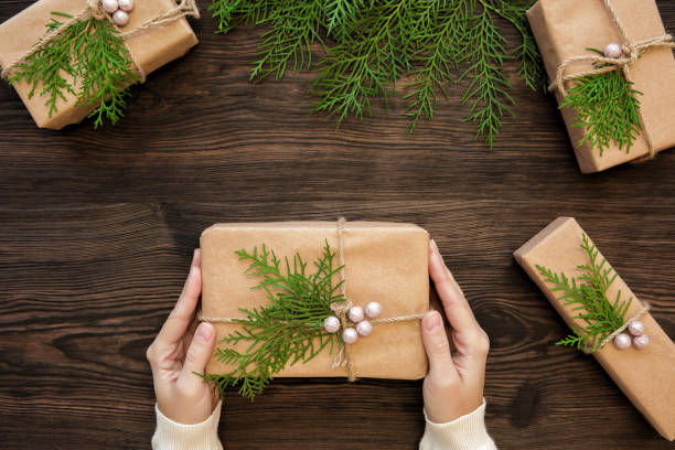 istock Female hands holding Christmas gift 879595436
