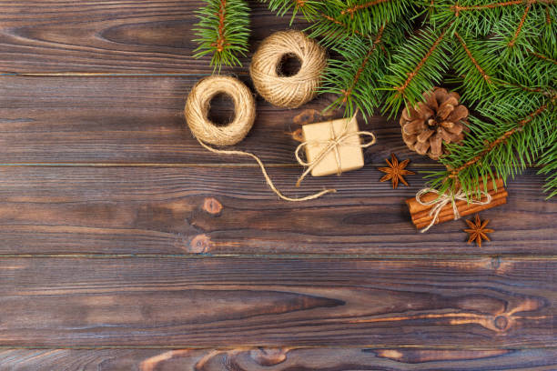 istock christmas present box. fir branches with cinnamon and anise on rustic wooden background. flat lay. seasonal greetings concept. winter holidays concept 879597848