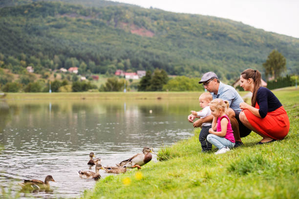 istock Happy family in nature in summer. 879598010