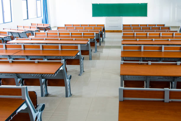 istock Desks and chairs in a lecture hall 879598358