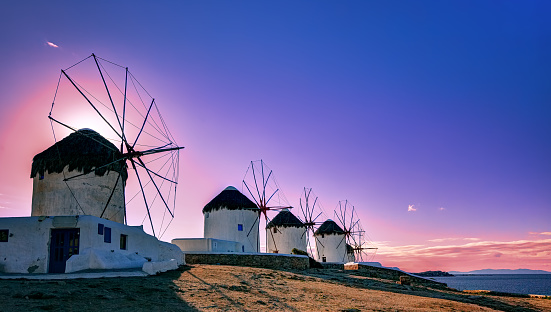 Traditional windmills, the symbol of Mykonos at sunset, Greece