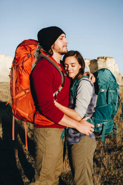 istock Couple hiking together in the wilderness 879603800