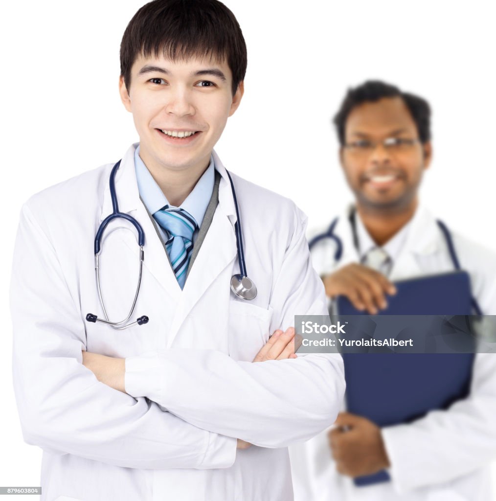 The doctor and Intern on a white background The doctor and the Intern for each other on white background Achievement Stock Photo