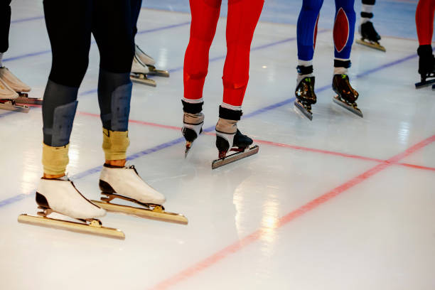 istock starting line legs men athletes speed skaters in mass start 879609242