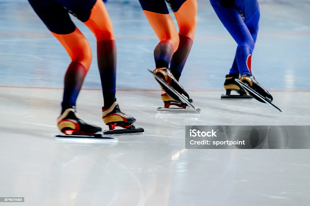 legs women athletes speed skaters in mass start competition Speed Skating Stock Photo