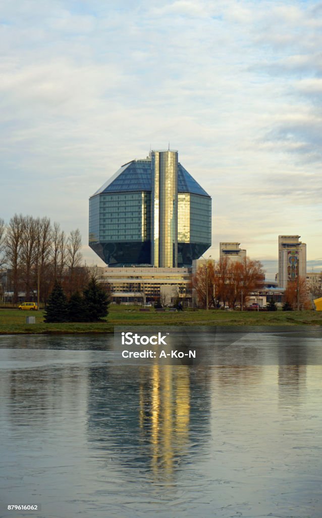 View of the National Library of Minsk city. November is a freezing day. View of the National Library of Minsk city. November is a freezing day. Ice on the water. Belarus Stock Photo
