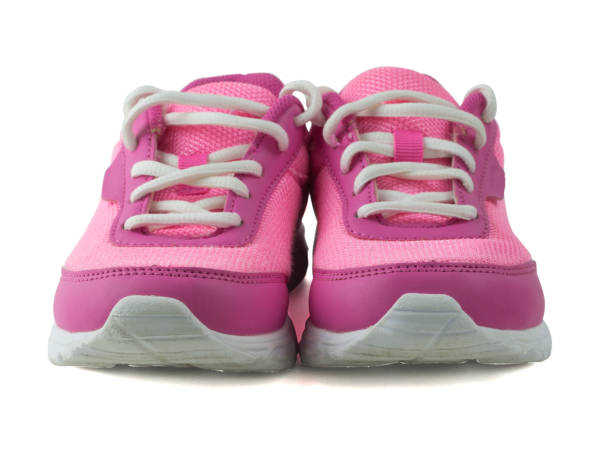 istock Womens pink sneakers with white laces isolated on white background. Front view. 879616096