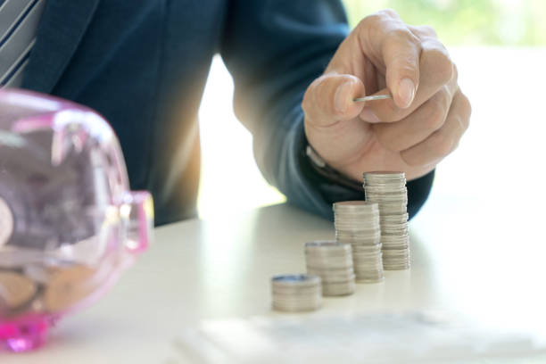 istock Business man hold collect coin 879624146