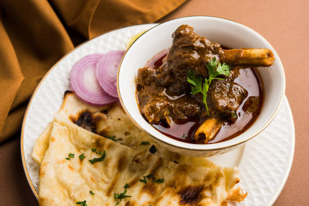Traditional indian cuisine. Assorted indian food on table in Restaurant. appetizers and Dishes of indian cuisine. Curry, rice, samosa, naan, butter chicken, chutney, spices, Palak Paneer, Tikka, Roti